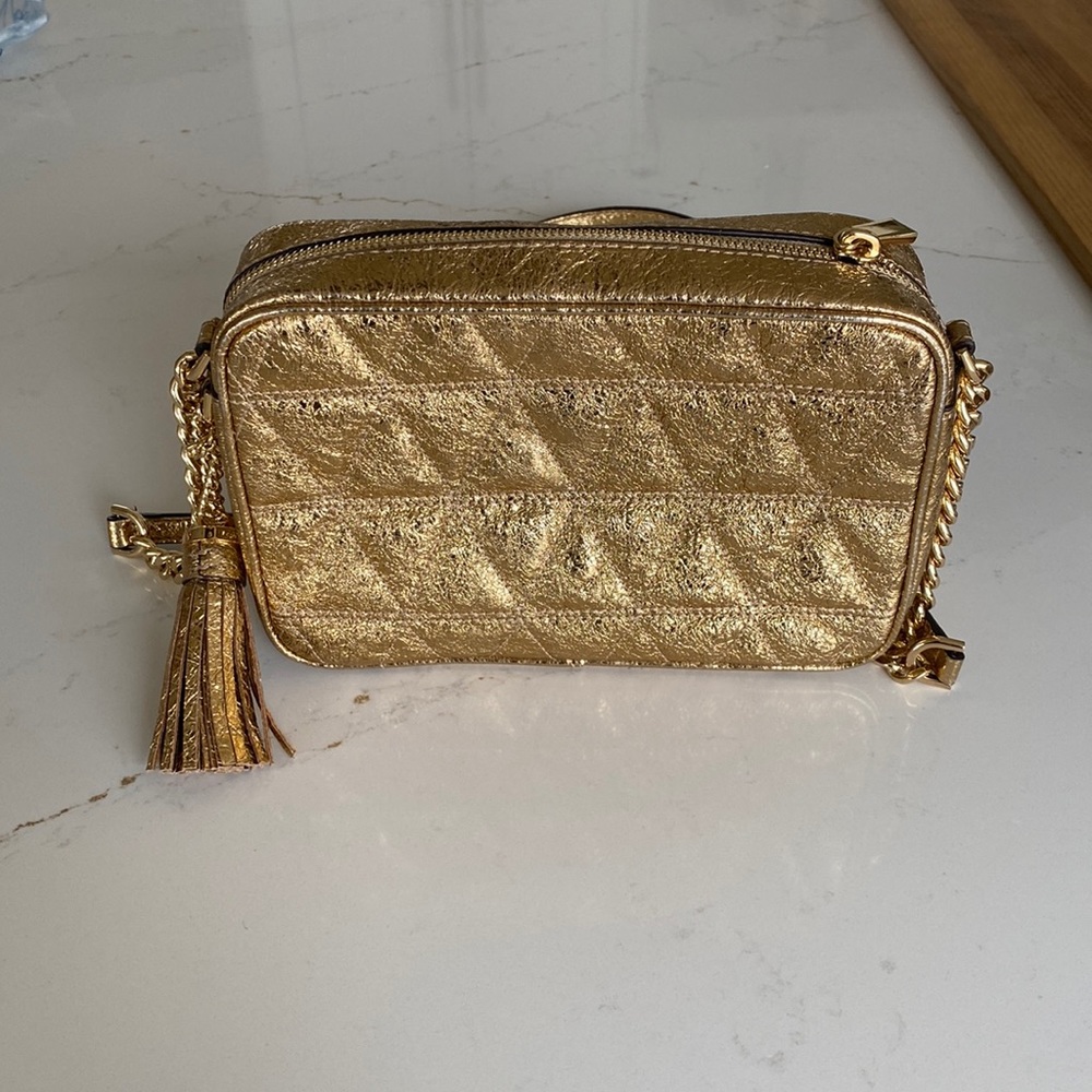 Michael kors gold leather crossbody bag.